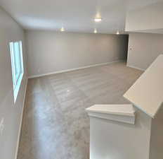 Large family room in the basement with a huge window!