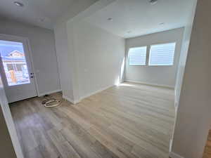 Unfurnished room featuring light wood finished floors