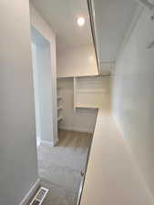 Walk in closet with 37' of linear hanging space