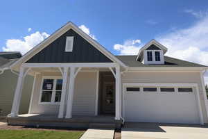 2 car garage with one (27') long stall