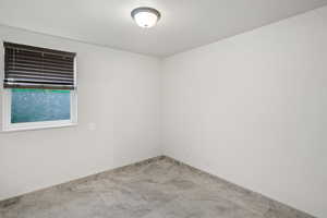 Unfurnished room featuring baseboards