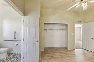 Unfurnished bedroom featuring a closet, light wood-type flooring, and baseboards