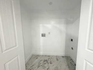 Laundry area with electric dryer hookup, marble finish flooring, baseboards, and washer hookup