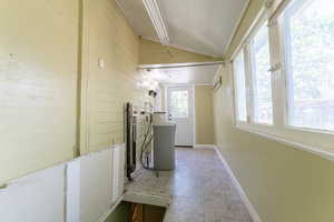 Laundry room featuring brick patterned flooring