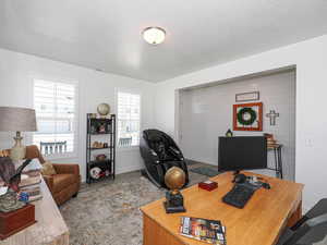 Office area featuring wood finished floors and baseboards