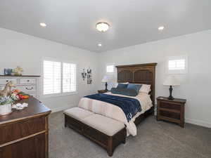 Primary Bedroom with carpet, baseboards, and recessed lighting