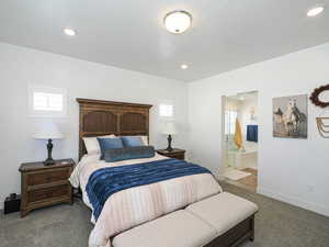 Primary Bedroom with carpet, recessed lighting, baseboards, and connected primary bathroom