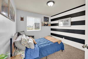 Bedroom featuring carpet flooring