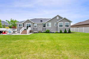Rear view of property with a patio and stucco siding