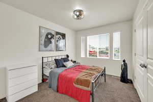 Bedroom with carpet and baseboards