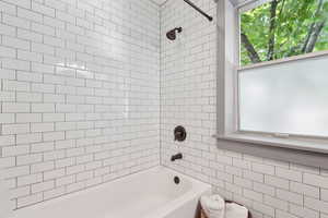 Bathroom featuring shower / washtub combination