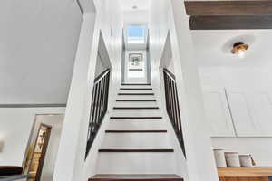 Stairs were updated with new solid oak treads and custom railing. Skylight was added at the top of the steps.