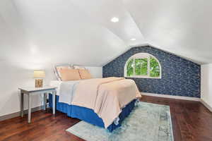 Nice sized bedroom upstairs with a queen bed. Sellers added closets to both upstairs bedrooms. Closet door made of reclaimed wood from the original barnwood floors.