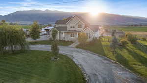 View of front of house with asphalt driveway and a mountain view