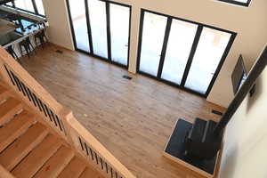Stairs with baseboards and wood finished floors