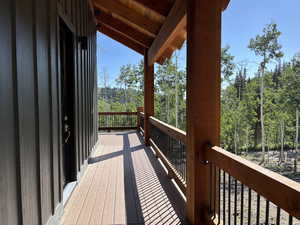 Wooden terrace with a wooded view