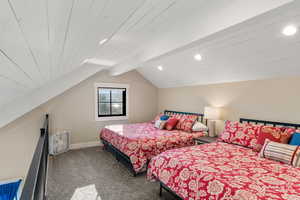 Carpeted bedroom with recessed lighting, baseboards, and wood ceiling