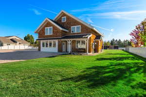 View of front of home featuring a standing seam roof and metal roof