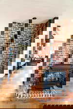 Detailed view of a wood stove and wood finished floors