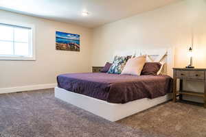 Carpeted bedroom with baseboards