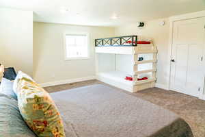 Carpeted bedroom with baseboards