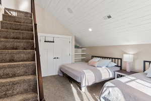 Carpeted bedroom with lofted ceiling, wooden ceiling, and recessed lighting