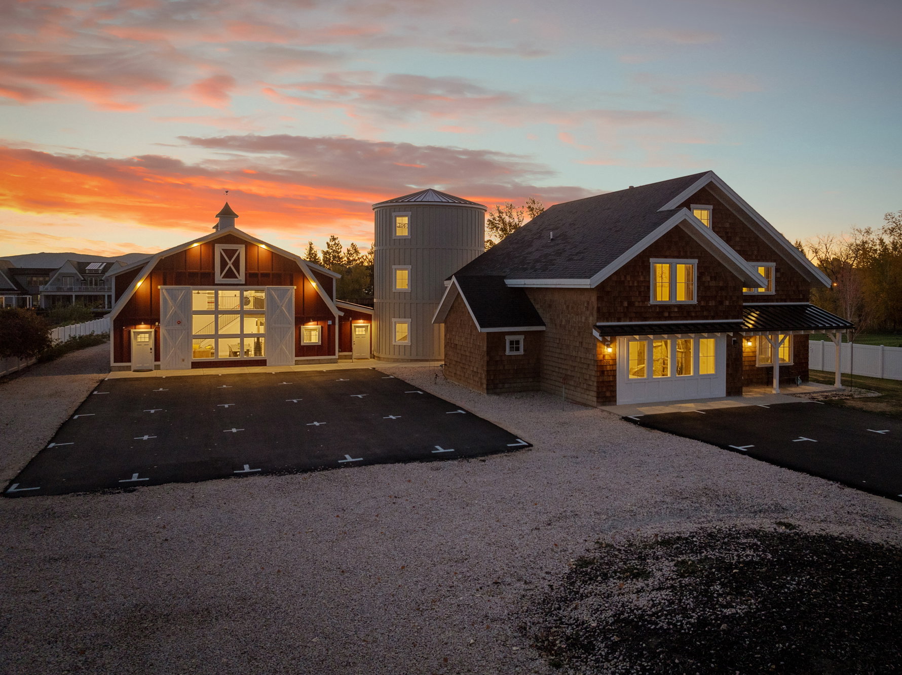 View of front of house featuring a barn and an outbuilding