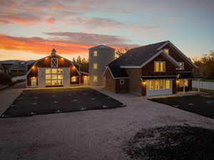 View of front of house featuring a barn and an outbuilding