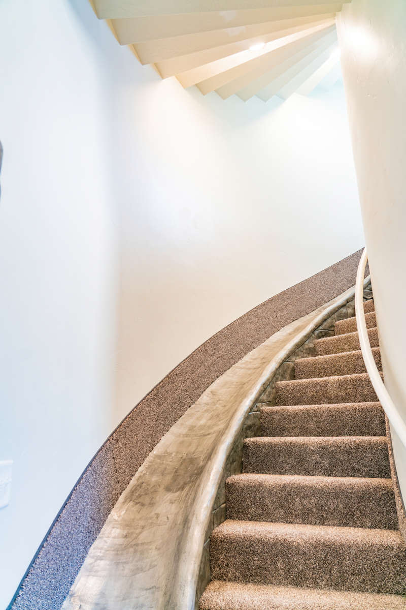 Stairway featuring beam ceiling