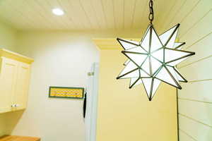 Detailed view of recessed lighting and white refrigerator