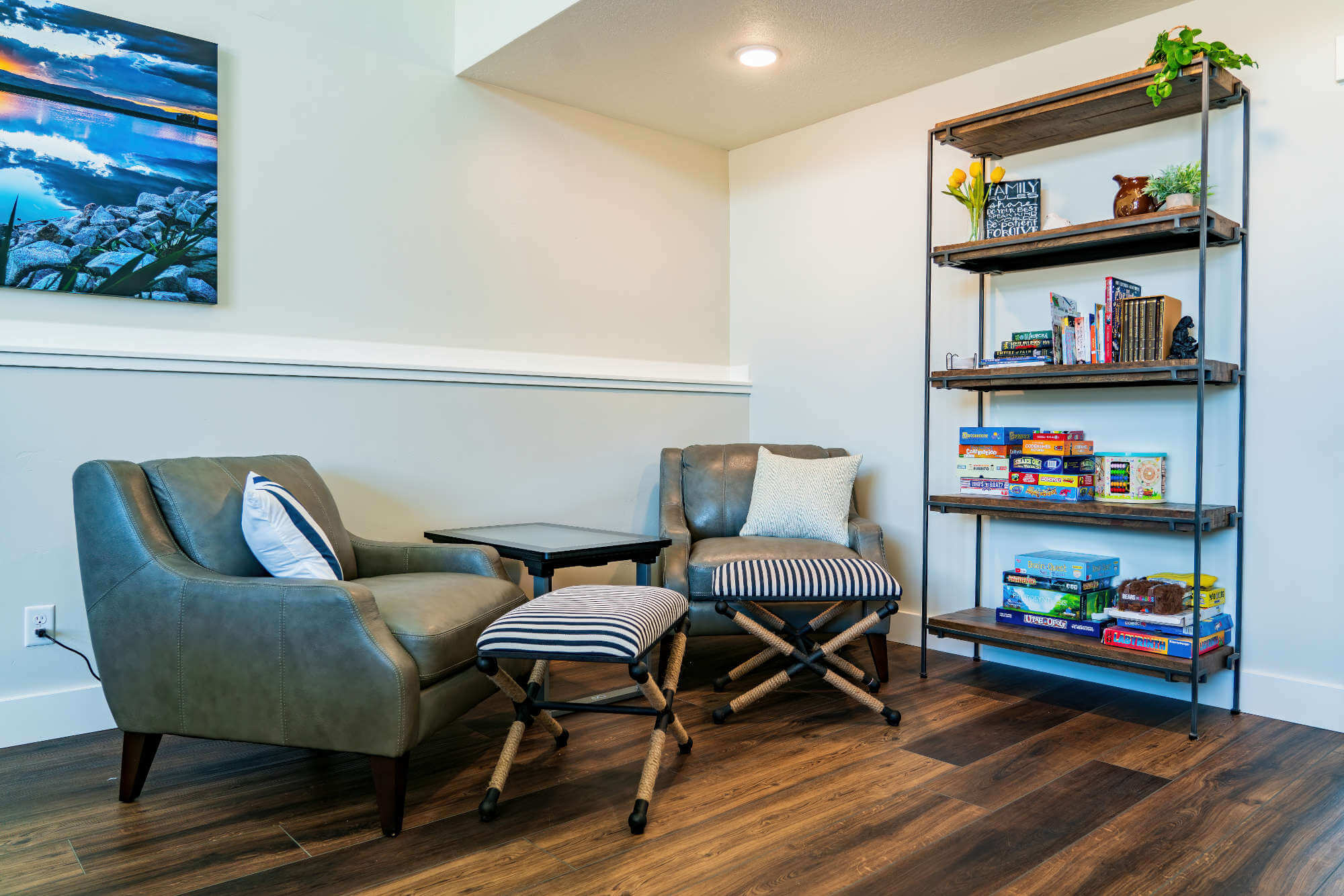 Living area with wood finished floors, baseboards, and recessed lighting