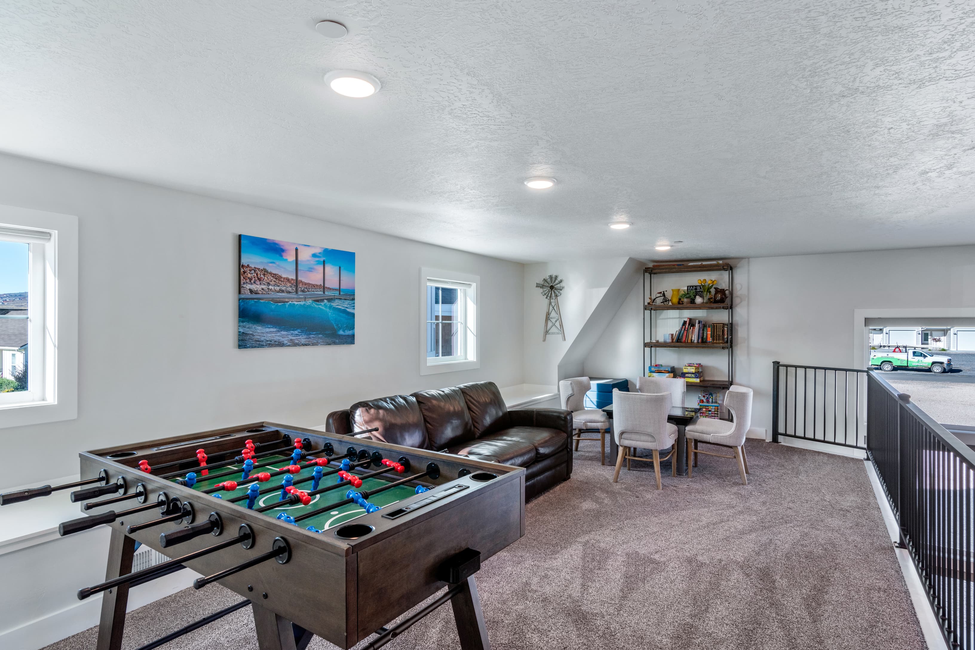 Rec room featuring carpet, a textured ceiling, and recessed lighting