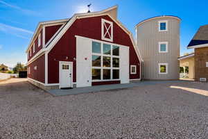 View of building exterior with a barn