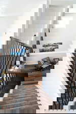 Staircase featuring wood finished floors and baseboards
