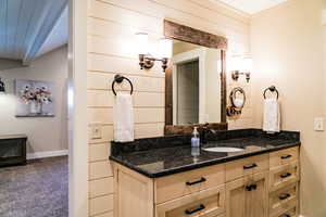 Bathroom featuring vanity and baseboards