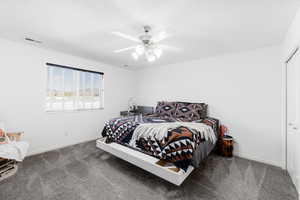 Bedroom featuring carpet floors, baseboards, a ceiling fan, a closet, and a textured ceiling