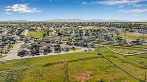 Aerial view of residential area featuring a mountain backdrop