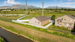 Overview of rural landscape featuring a mountain backdrop