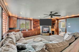 Living area featuring a tile fireplace.