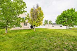 View of yard featuring a patio area and an outbuilding
