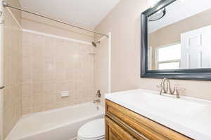 Full bathroom with vanity, toilet, and shower / bathtub combination