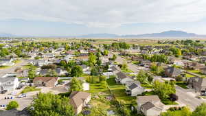 Aerial perspective of suburban area with a mountainous background