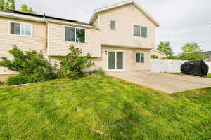 Back of property featuring a patio area