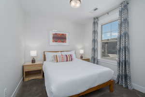 Carpeted bedroom with baseboards