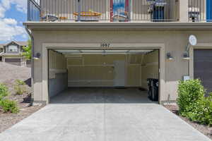 Garage featuring driveway