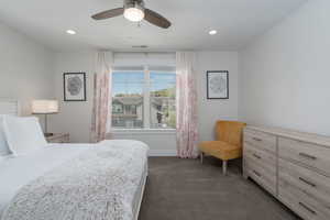 Bedroom with dark carpet, recessed lighting, baseboards, and ceiling fan