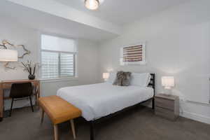 Carpeted bedroom with baseboards