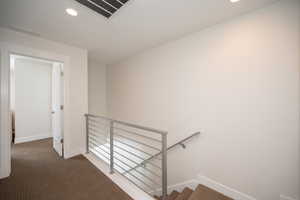 Stairs with baseboards, carpet floors, and recessed lighting
