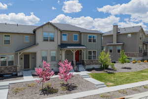 View of front of property featuring board and batten siding and stone siding