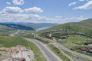 Bird's eye view of a water and mountain view and a main thoroughfare